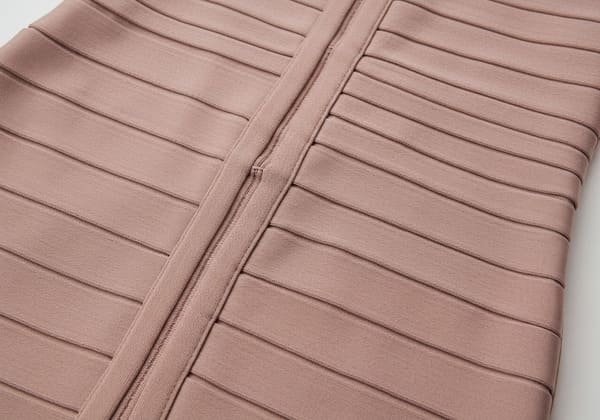 Close-up of bandage dress materials in nude pink