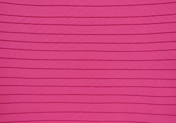 A close-up of a high-quality bandage dress fabric weave